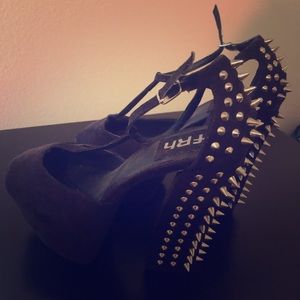 Spiked peep toe high heels.
